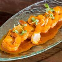 Gambas Al Pimenton · Seared shrimp with smoked spanish paprika, sliced garlic, dry sherry, lemon and a touch of b...