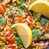 Mixed Mushroom Paella · Paella is a spanish rice dish that is simmered with mushroom broth, saffron, vegetables and ...