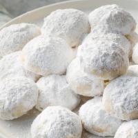 Wedding Cookies (dozen) · Delicate shortbread cookies with fresh ground pecans and lemon zest. Sold by the dozen.