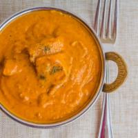 Chicken Tikka Masala · Diced tandoori chicken cooked in creamy sauce and spices.