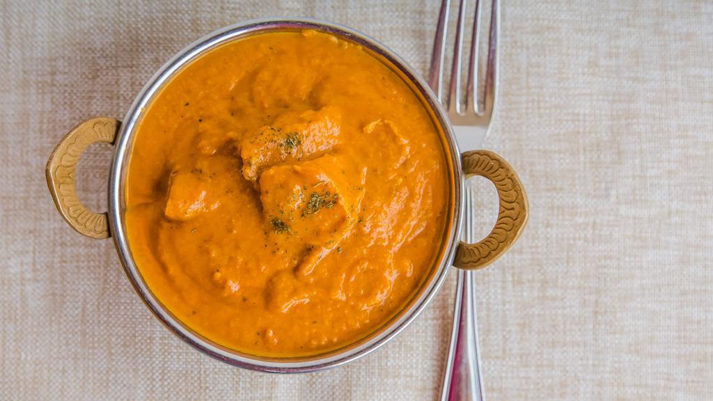 Chicken Tikka Masala · Diced tandoori chicken cooked in creamy sauce and spices.