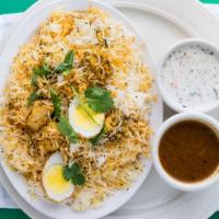 Chicken Biriyani · Basmati rice cooked with tender pieces of spiced chicken.