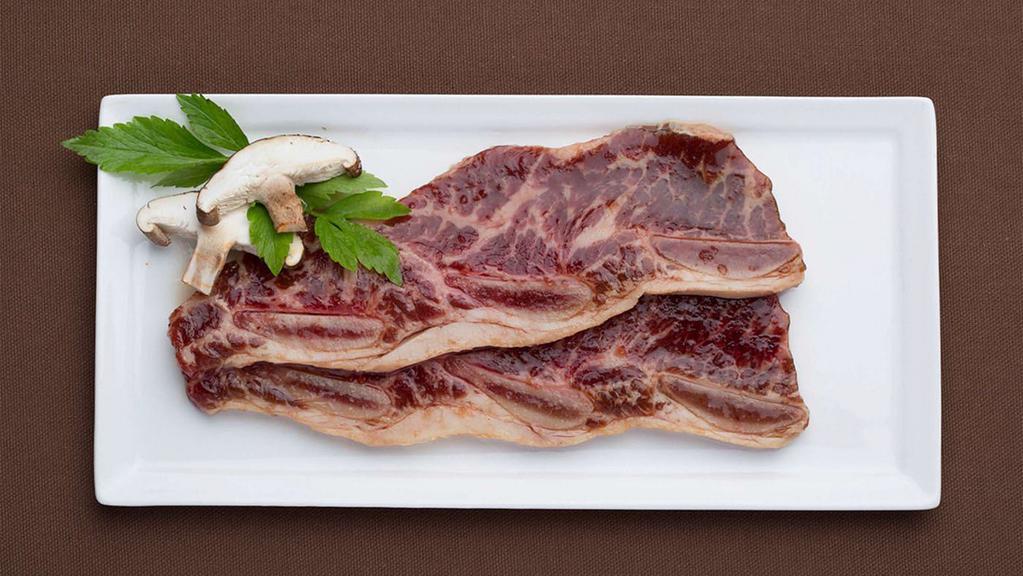 Yangyum Galbi (1 Lb) · Bone-in short rib. Contains raw meat.