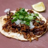 Carnitas Taco · The Venganza vegan carnitas taco is 2 oz of our carnitas, hand-pressed tortilla, onions, cil...