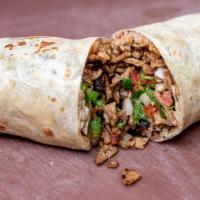 Carne Asada Burrito · The carne asada burrito contains venganza vegan carne asada, refried pinto beans, mexican ri...