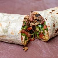 Carnitas Burrito · The carnitas burrito contains Venganza vegan carnitas, refried pinto beans, Mexican rice, pi...