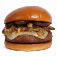 The Mushroom Lover Burger · Beef patty with roasted mushrooms, caramelized onions, melted swiss cheese, and mayo on a fl...