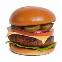The Classic Burger · Beef patty with lettuce, tomato, onion, pickles, mayo, and melted cheddar cheese on a fluffy...
