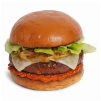 The New Classic Burger · Beef patty with lettuce, ketchup, caramelized onions, mayo, and melted swiss cheese on a flu...