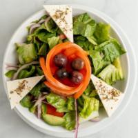 Greek Salad · Romaine lettuce, vine tomatoes, feta cheese, cucumbers, red onions, kalamata olives, peperon...