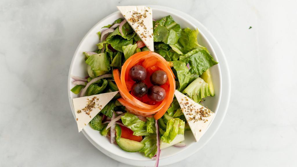 Greek Salad · Gluten-free. Romaine, sheep feta, olives, pepperoncini, tomato, cucumber, onion, balsamic vinaigrette.