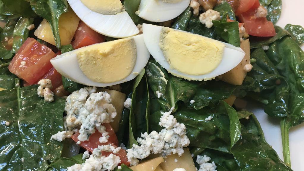 Spinach Salad · Spinach, vine tomatoes, red onions, crumbled blue cheese, pecans and our specialty dressing.