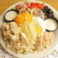 Chef's Salad · Mixed greens with turkey, ham, jack and cheddar cheese, sliced egg, mushrooms, dice tomatoes...