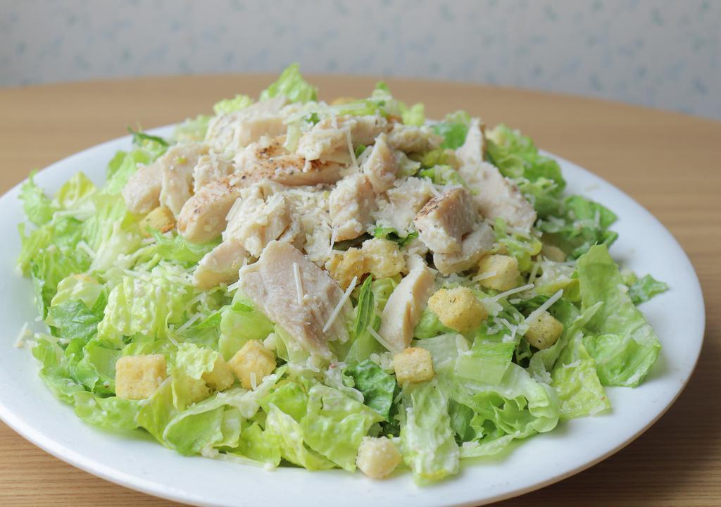 Caesar Salad With Chicken · Our Caesar salad topped with strips of grilled chicken.
