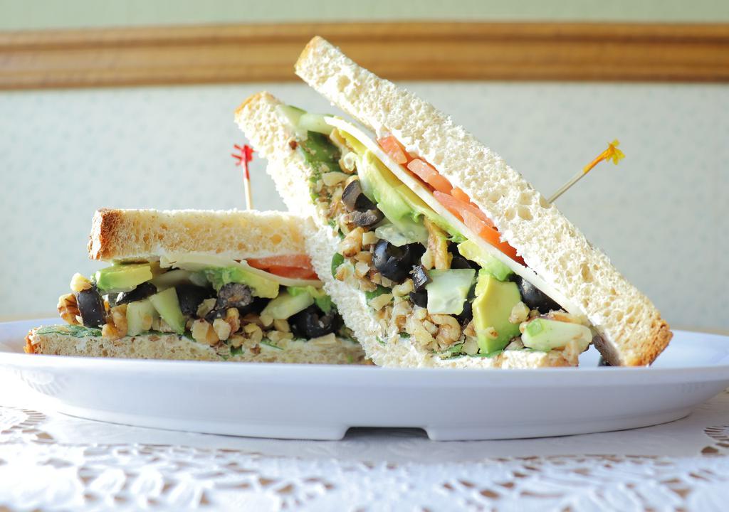 Stewartville · Wheat bread, avocado, cream cheese, black olives, spinach, tomato, cucumber, jack cheese and diced walnuts.