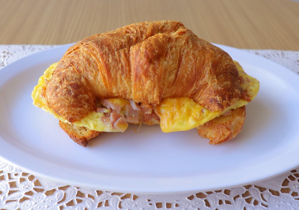 Croissant Breakfast Sandwich · Ham, scrambled eggs, monterey jack cheese.