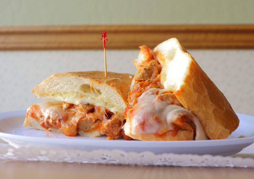 Arlington Hotel · Meatballs in spaghetti sauce, with jack and Parmesan cheese, served on a roll.