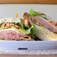Contra Loma · Pastrami on rye bread with mustard, mayo, tomato, jack cheese and leaf lettuce. served hot o...