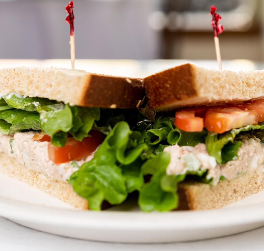 Rivertown · Albacore tuna blended with mayo, green onion, celery and chopped egg served on wheat bread with tomato and green leaf lettuce.