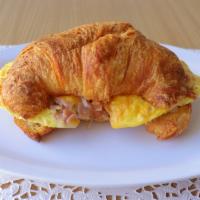 Croissant Breakfast Sandwich · Ham, scrambled eggs, monterey jack cheese.