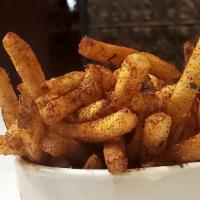 Cajun Fries · Thin-cut French fries dusted with our house made Cajun magic spice, served with ketchup on t...