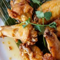 Chicken Wings · Crispy fried chicken wings sautéed in our house-made sweet and sour with the hint of chili t...