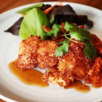 The fish  · Crispy panko breaded fresh water white fish with sweet garlic sauce serve with house Green s...