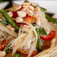 Papaya Salad · Green papaya, string beans, tomato and peanuts tossed in Thai style SOM TUM dressing served ...