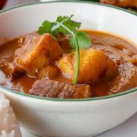 Mussamun Curry · Braised Beef, potatoes, nuts, and coconut milk in Massamun Curry