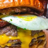 Bigg Boss Burger · Two Beef patty, Halal beef bacon, American Cheese, Cheddar cheese, Tomato, onion, lettuce, P...