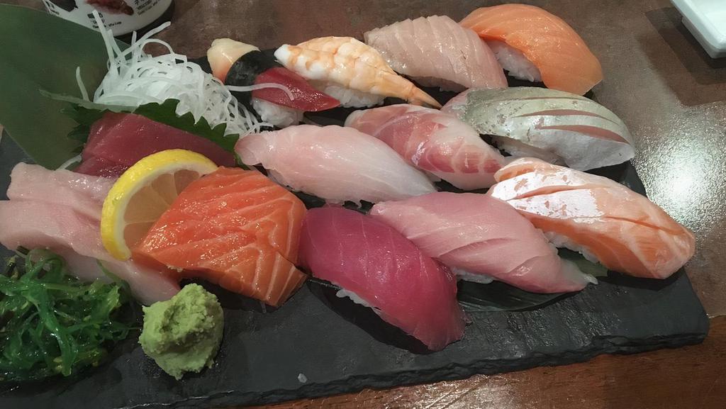 S7-A. Tomodachi Sushi Combo · Sashimi (12 pcs), nigiri (12 pcs), tekka and California roll.
