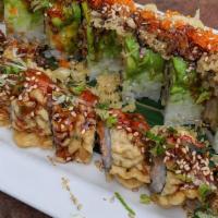 S2-N. Godzilla Roll · Fried salmon roll with green onion and spicy sauce on top.