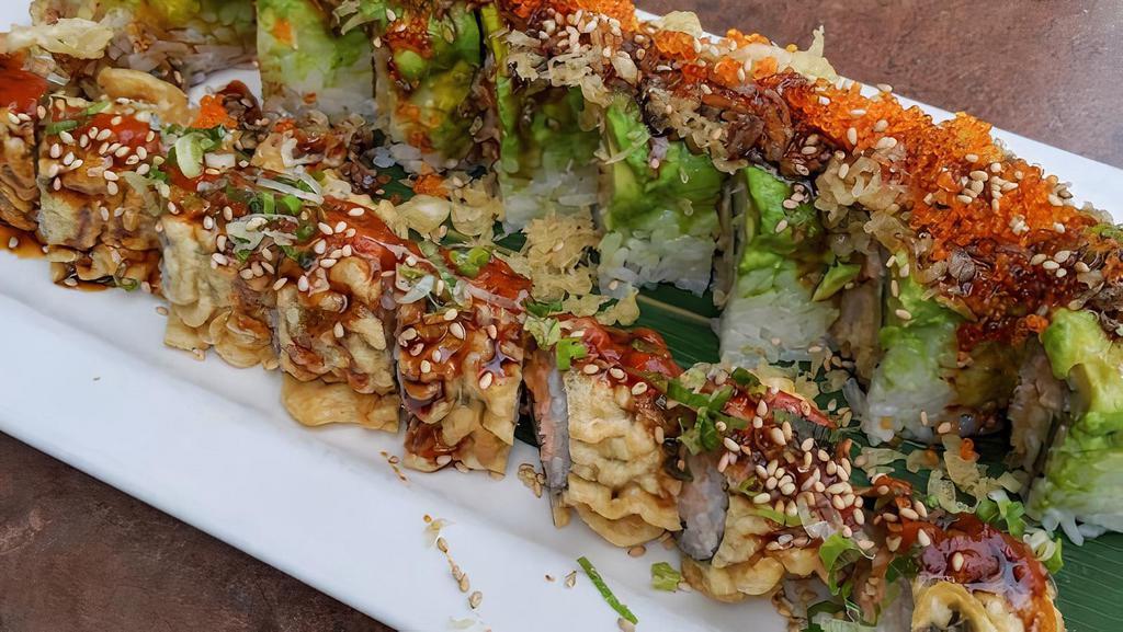 S2-N. Godzilla Roll · Fried salmon roll with green onion and spicy sauce on top.