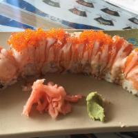 Island Roll · Shrimp tempura, crab meat, cucumber top: salmon, tobiko, sauce.