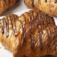 Chocolate Croissant · Butter croissant, dark chocolate filling, dark chocolate drizzle.

Contains: Coconut, Milk, ...