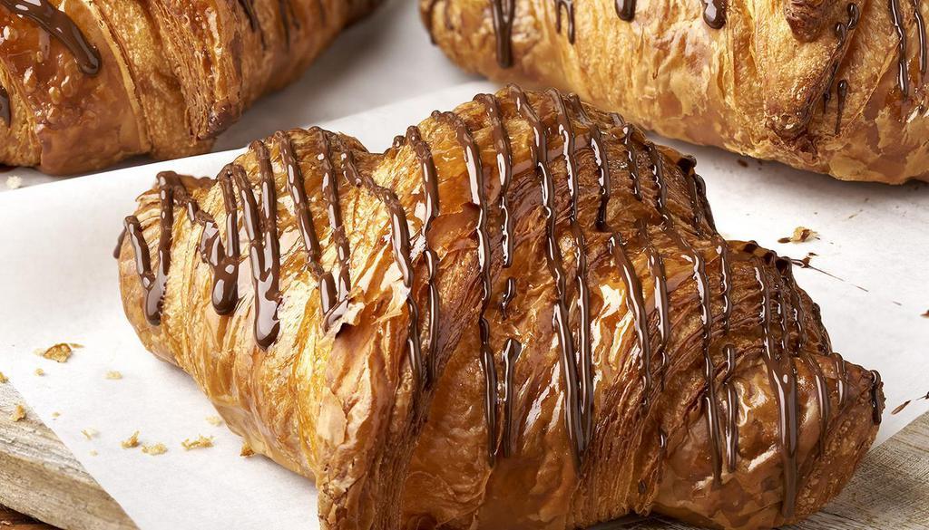 Chocolate Croissant · Butter croissant, dark chocolate filling, dark chocolate drizzle.

Contains: Coconut, Milk, Soy, Wheat