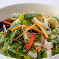 Yum Pla Muk · Spicy squid salad with romaine, chili, lime, fresh herbs