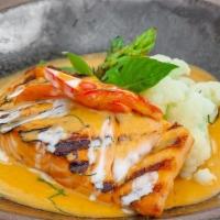 Choo Chee Pla · Charcoal grilled Atlantic salmon, steamed bok choy, kaffir lime red curry, coconut cream