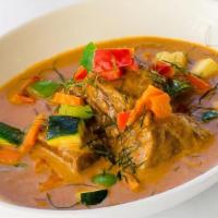 Panang Short Ribs · Stewed beef short ribs in panang curry, grilled zucchini, bell peppers, kaffir lime leaf