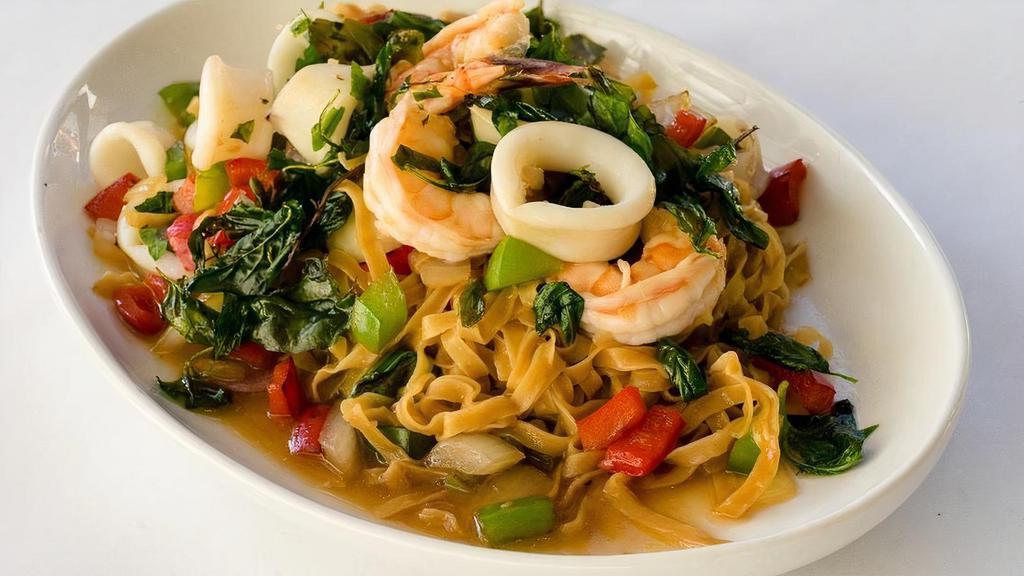 Seafood Garlic Noodle · Basil’s seafood garlic noodle of squid, shrimp, scallop, Napa cabbage, chili, fresh basil