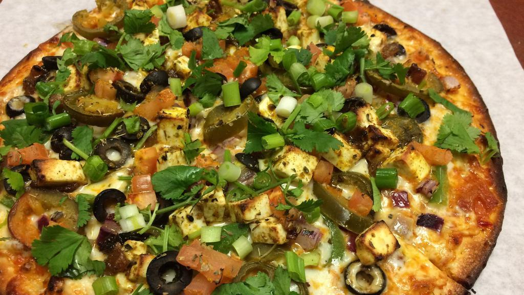 Chilli Paneer · Curry sauce, mozzarella, green bell peppers, diced tomatoes, red onions, masala paneer, green onions, and fresh cilantro.