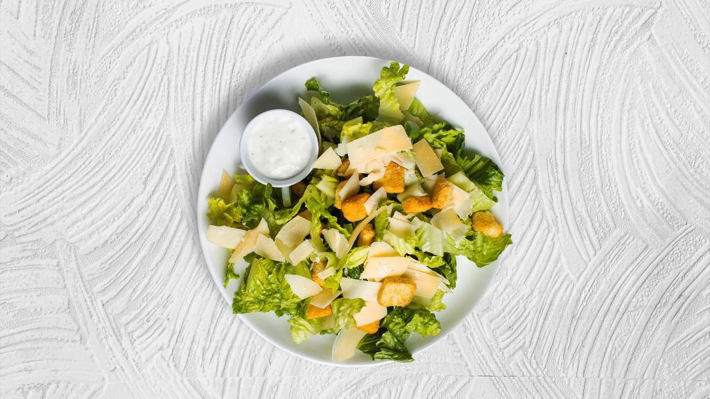 Romaine Empire Salad · (Vegetarian) Romaine lettuce, house croutons, and parmesan cheese tossed with Caesar dressing.