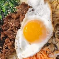 Galbi Hot Stone Bibimbap · Bean sprouts, soybean sprouts, radish, rape, mushroom, and carrots over rice and sesame oil....