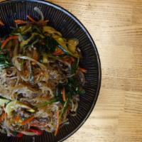 Jhap Chae · Stir-fry sweet potato noodles with beef, mushrooms, carrots, onions, fish cake, sesame oil a...