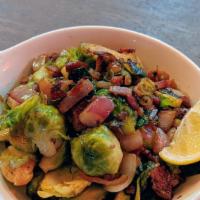Sautéed Brussels Sprouts with Bacon · bacon, olive oil, lemon, red onions and butter.