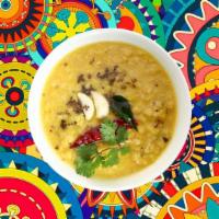 Bright Yellow Lentils  · Yellow lentils, cooked to perfection over a slow flame and tempered with 'ghee' and spices,