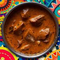 Lamb Zest Tikka Masala · Tender pieces of Lamb marinated in a blend of yogurt and mild tandoori spices, then baked in...
