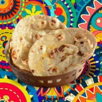 Butter Delight Naan  · House made hand pulled and leavened dough baked to perfection in an Indian clay oven and bas...