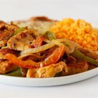 Fajitas Plate · Chicken or beef, rice, beans, onions, guacamole, peppers, sour cream, lettuce, and tomato.