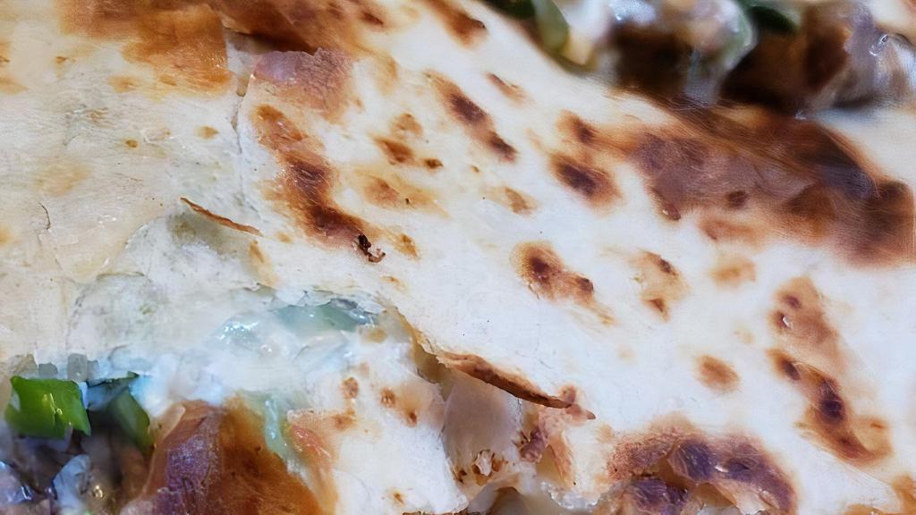Quesadilla Super · Flour tortilla, meat of your choice, cheese, cilantro, onions and sour cream.